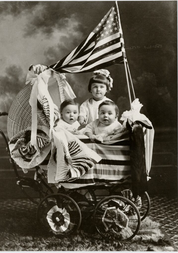 Babies in a carriage in black and white